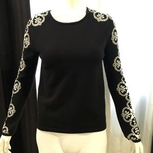 Black and white sweater with damask sleeves